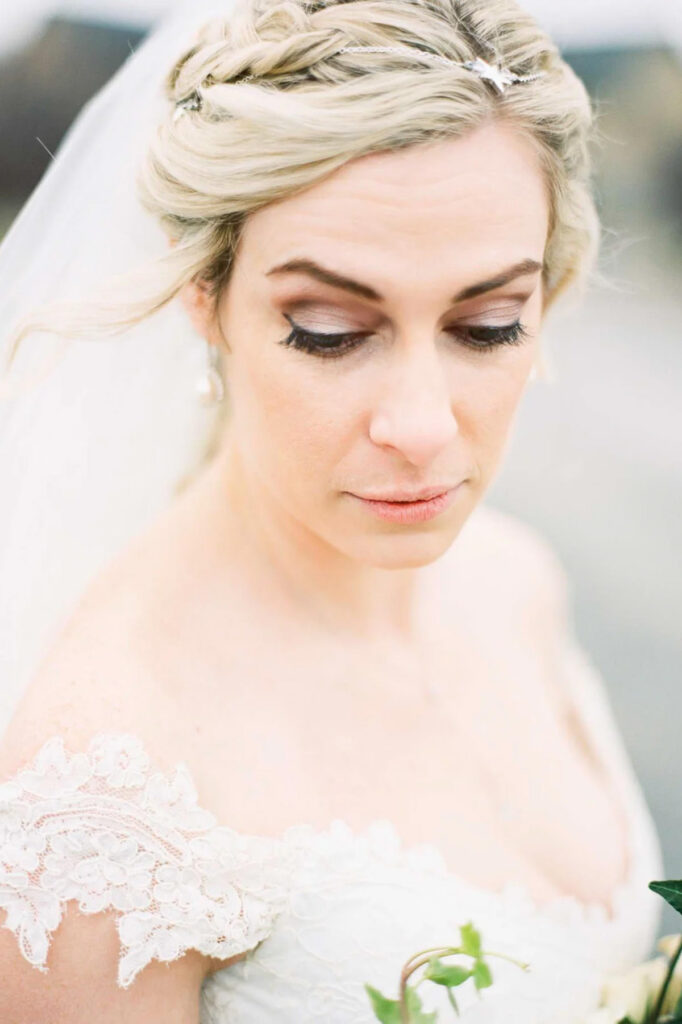 A close up photo of a bride looking down slightly