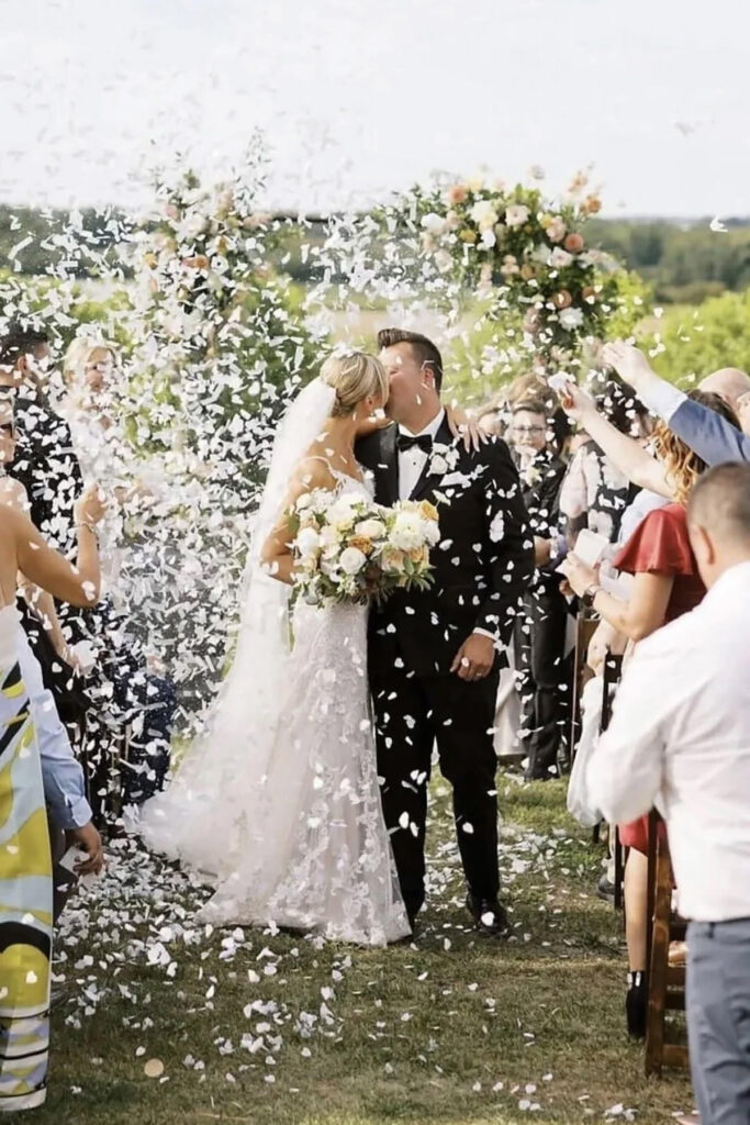 Confetti being thrown over a couple after the just got married