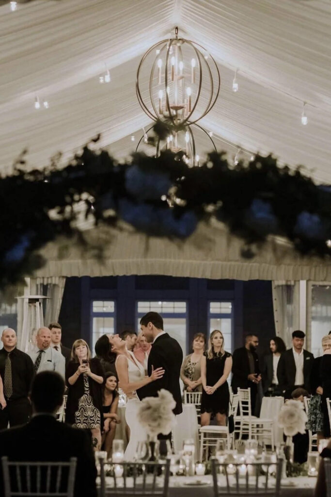 A couple dancing across the reception hall