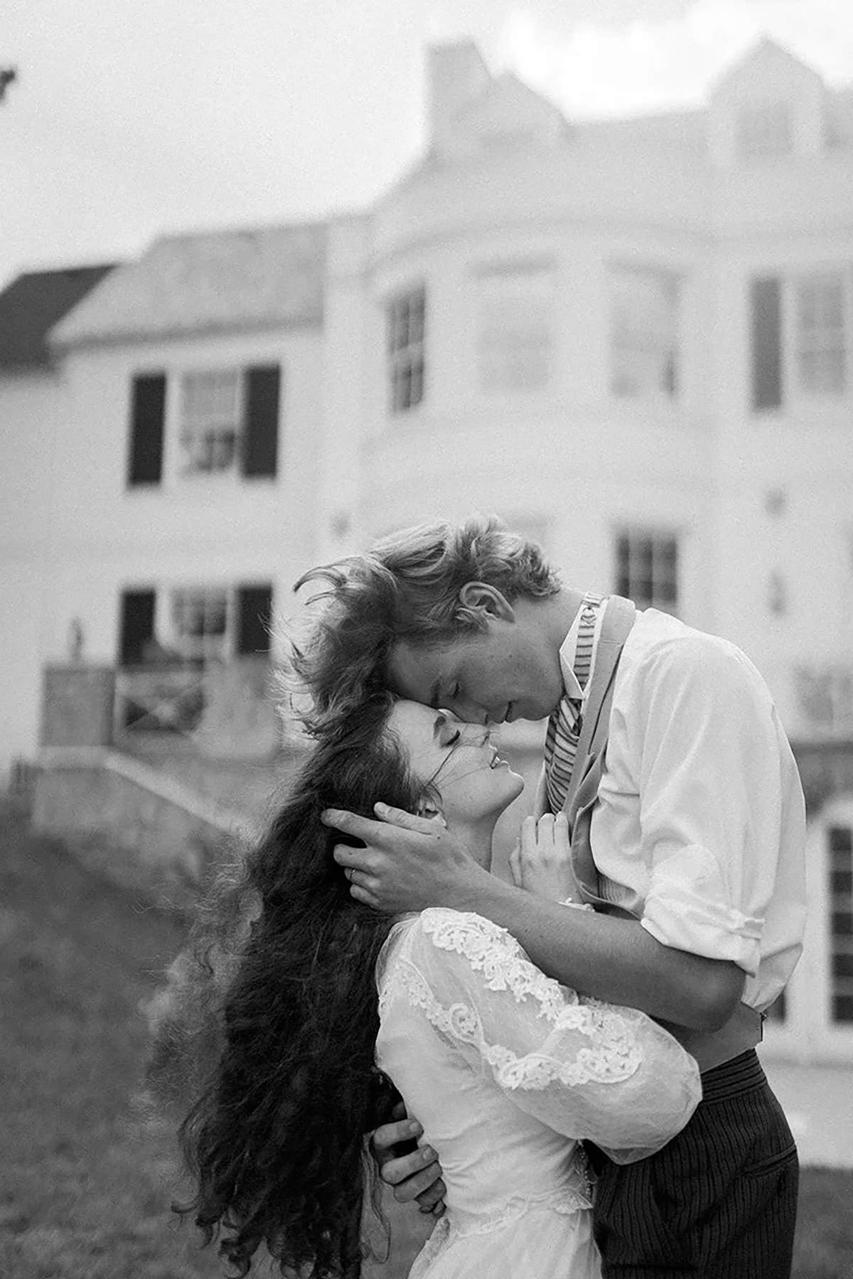 A man holding a woman's face passionately