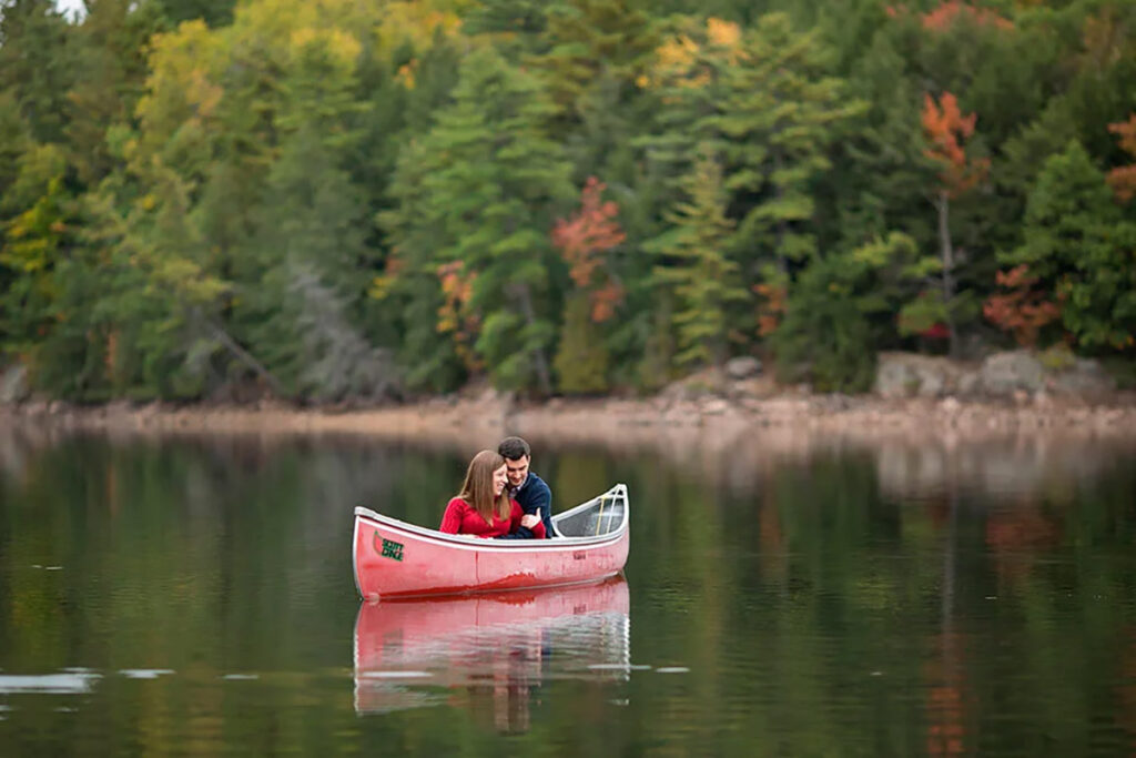 A couple embracing in a canoe on the water