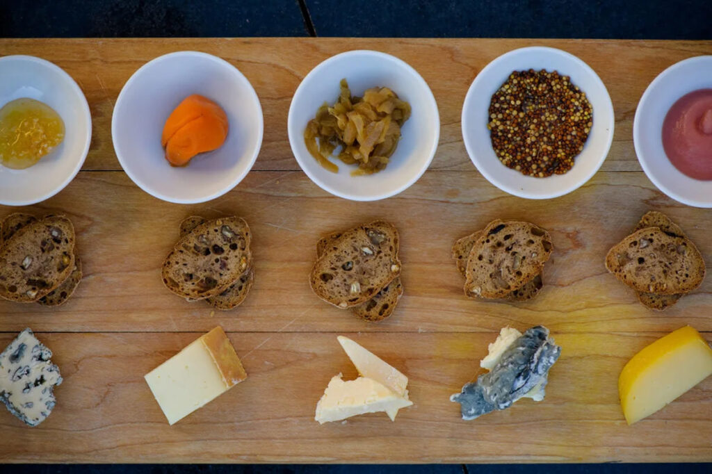 A wooden table with an array of appetizers