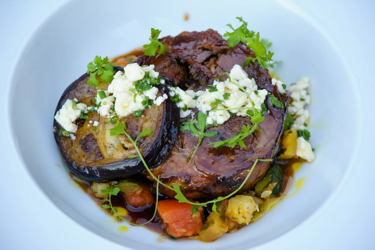 An elegantly plated dish with seasonal vegetables