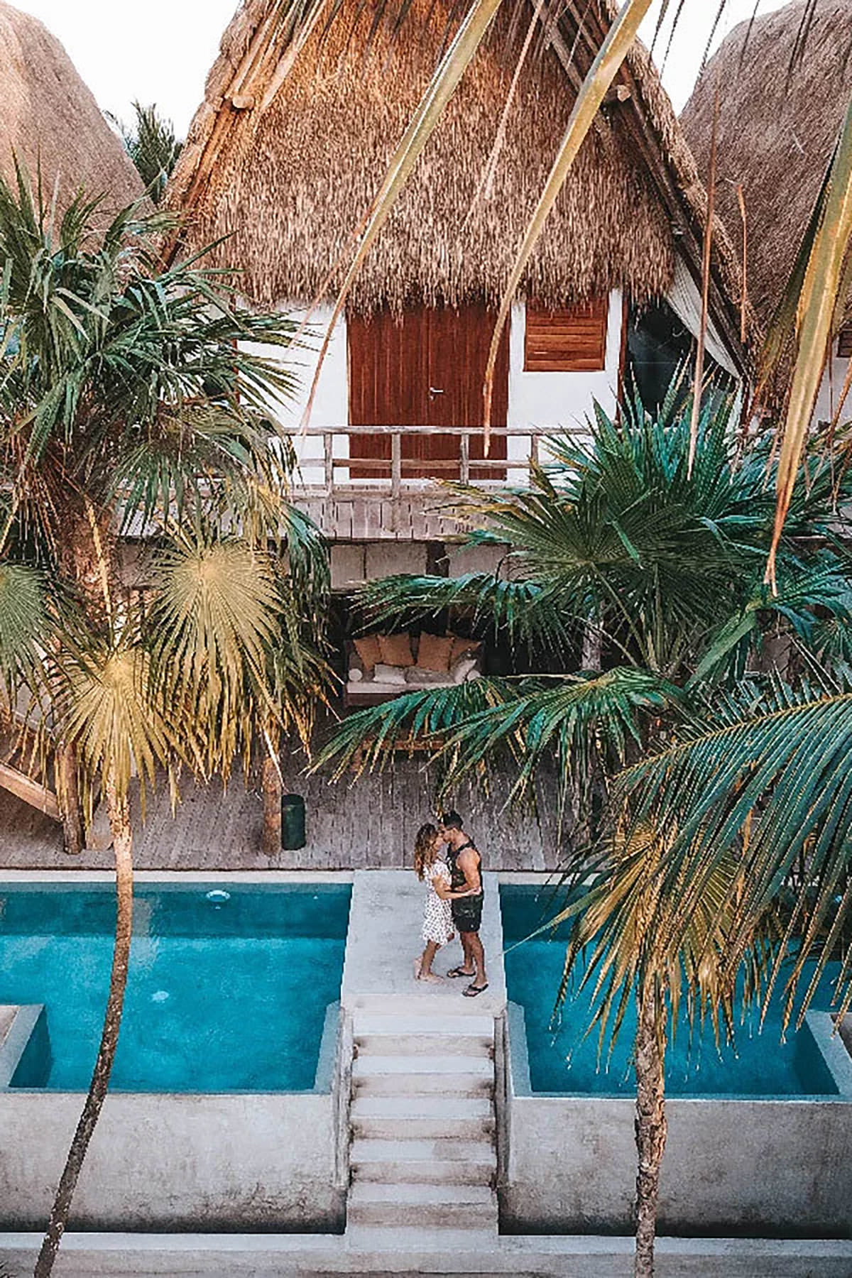 Tropical location from above with a couple below