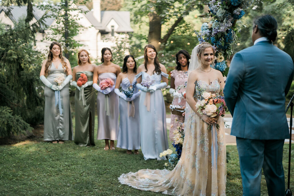 A ceremony with the wedding party in Bridgerton inspired wedding attire.