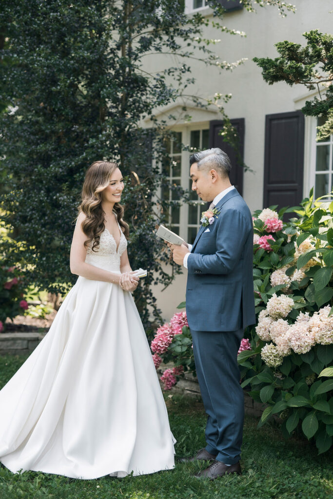 bride and groom exchanging vows privately in a garden setting