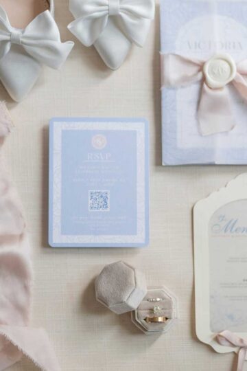 flatlay of wedding stationery and bridal shoes