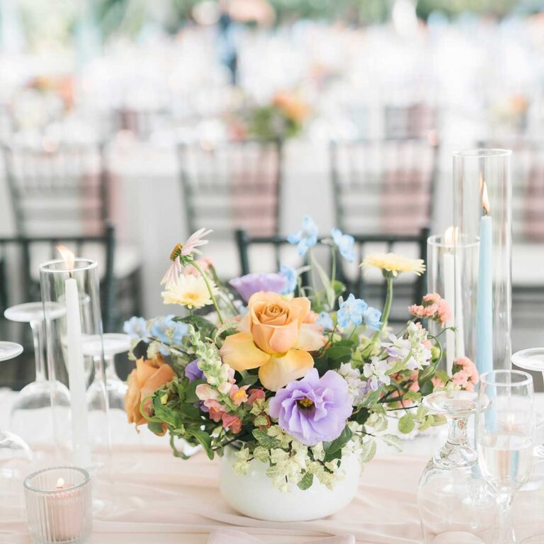 colourful floral centrepiece on wedding reception table