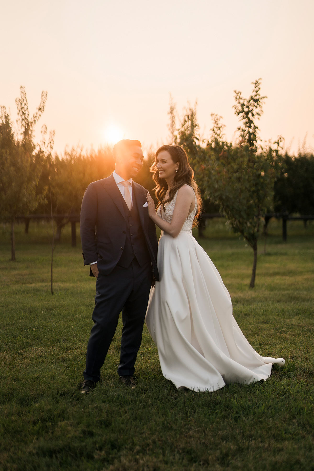 bride and groom golden hour orchard portrait