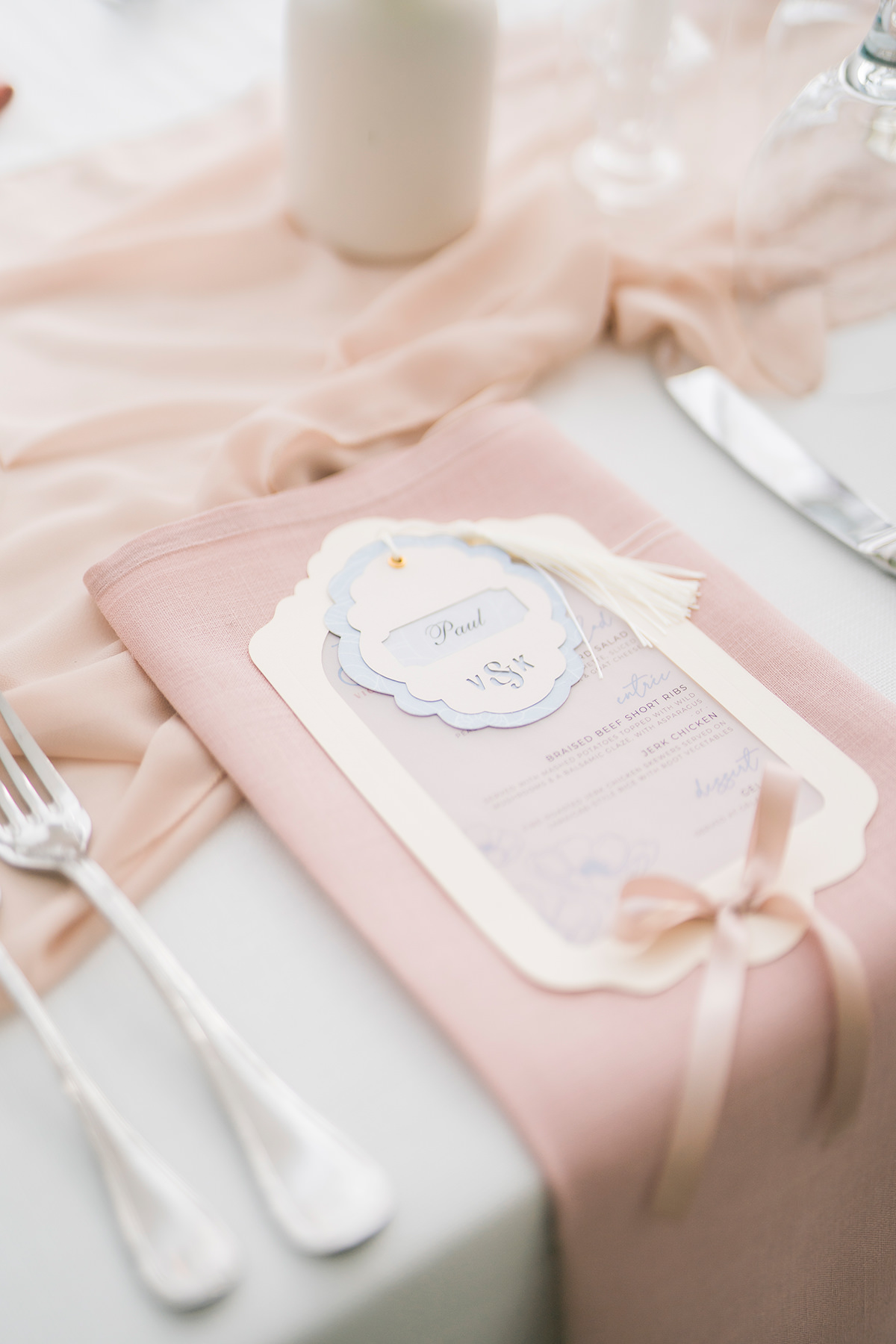 blush pink table setting with monogram and menu