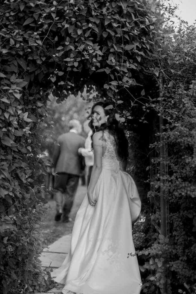 bride looking back in an icy covered doorway