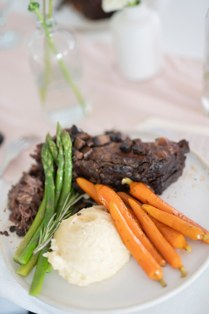 plated wedding meal with steak carrots and mashed potatoes