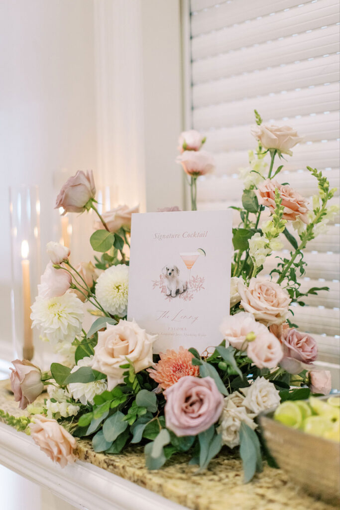 Flowers on a bar with a card in the middle.