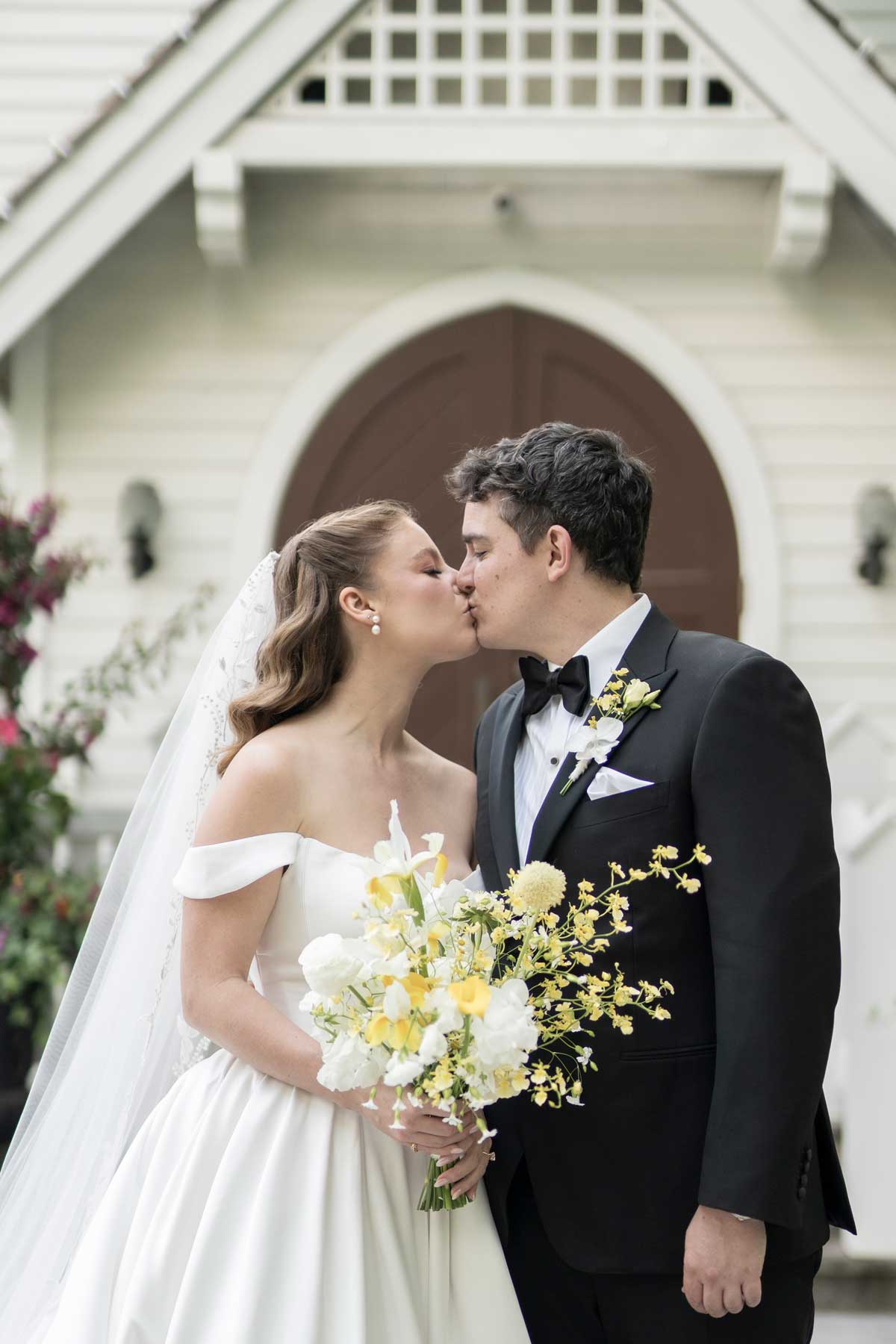 bride and groom outside the doctor's house chapel
