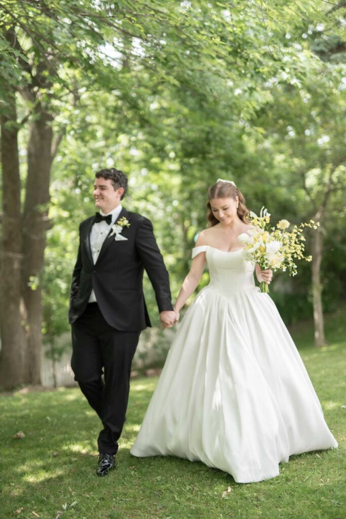 bride and groom walking outside