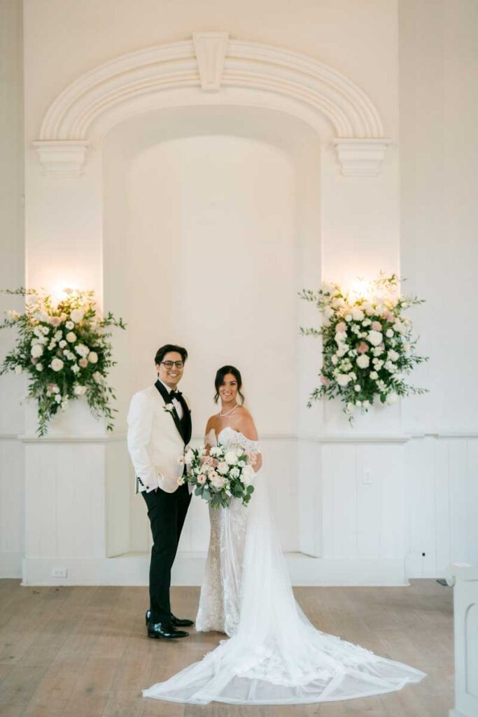 bride and groom standing in chapel ceremony site