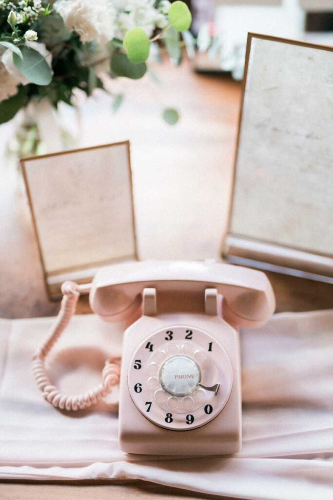 pink rotary phone on display as an audio guestbook
