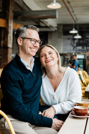 couple embracing in coffee shop