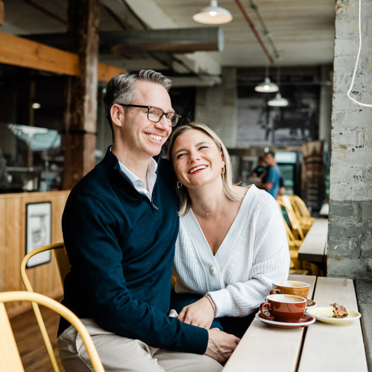 couple embracing in coffee shop