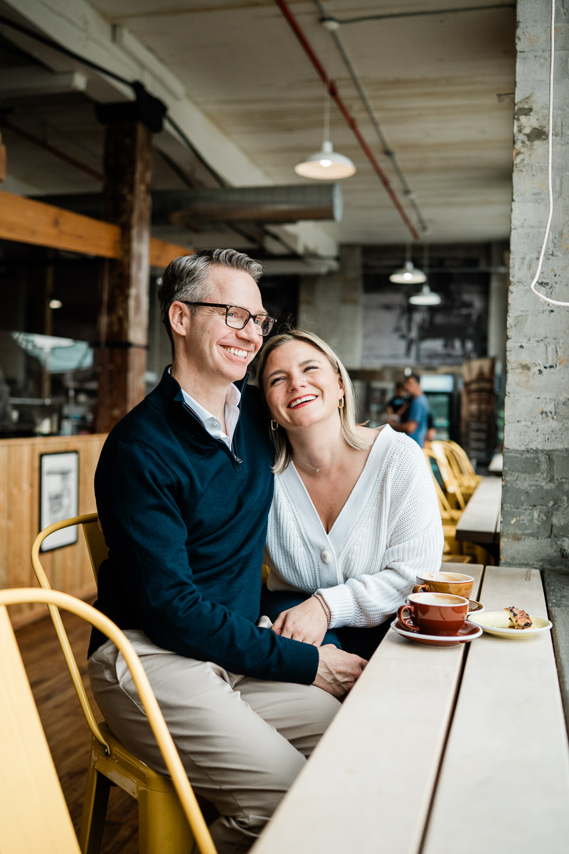 couple embracing in coffee shop