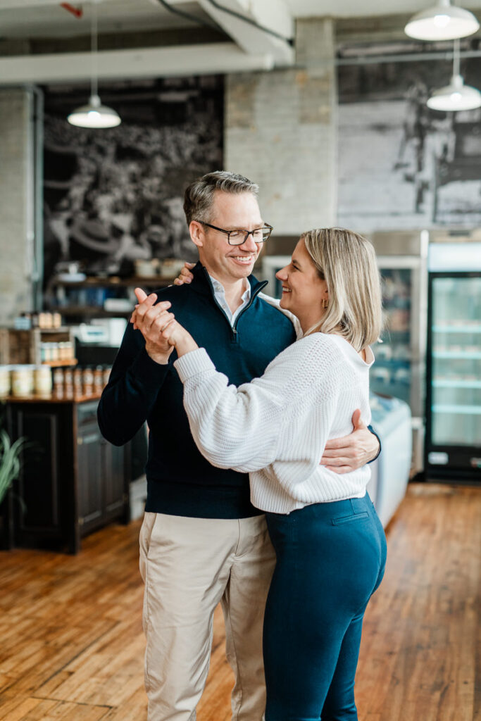 couple dancing in café market
