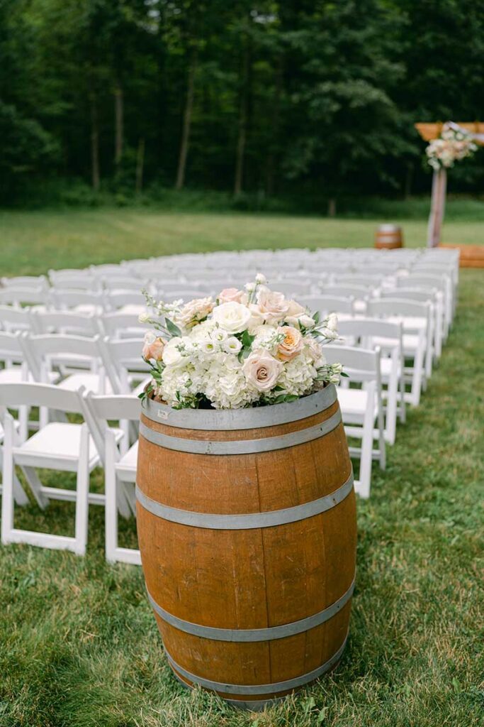 wine barrel topped with floral arrangement