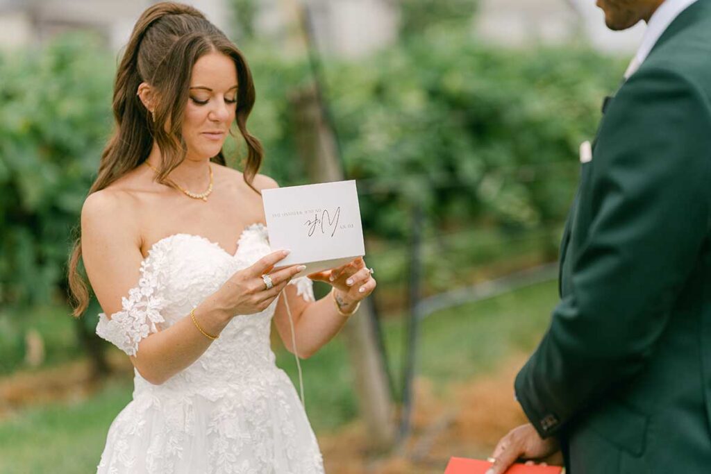 bride reading vows from a card